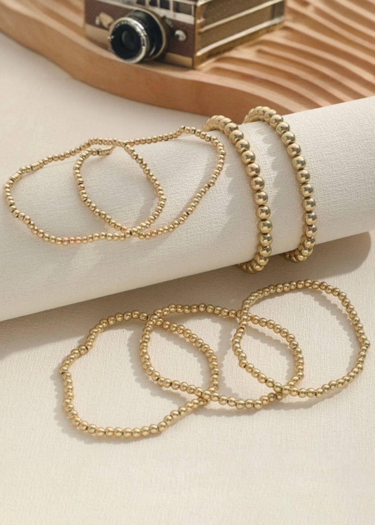 Gold beaded stack bracelets