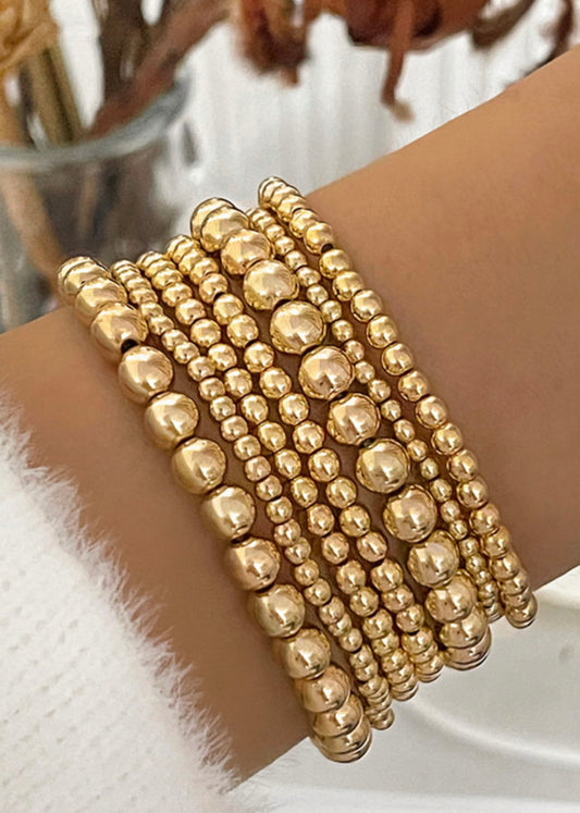 Gold beaded stack bracelets